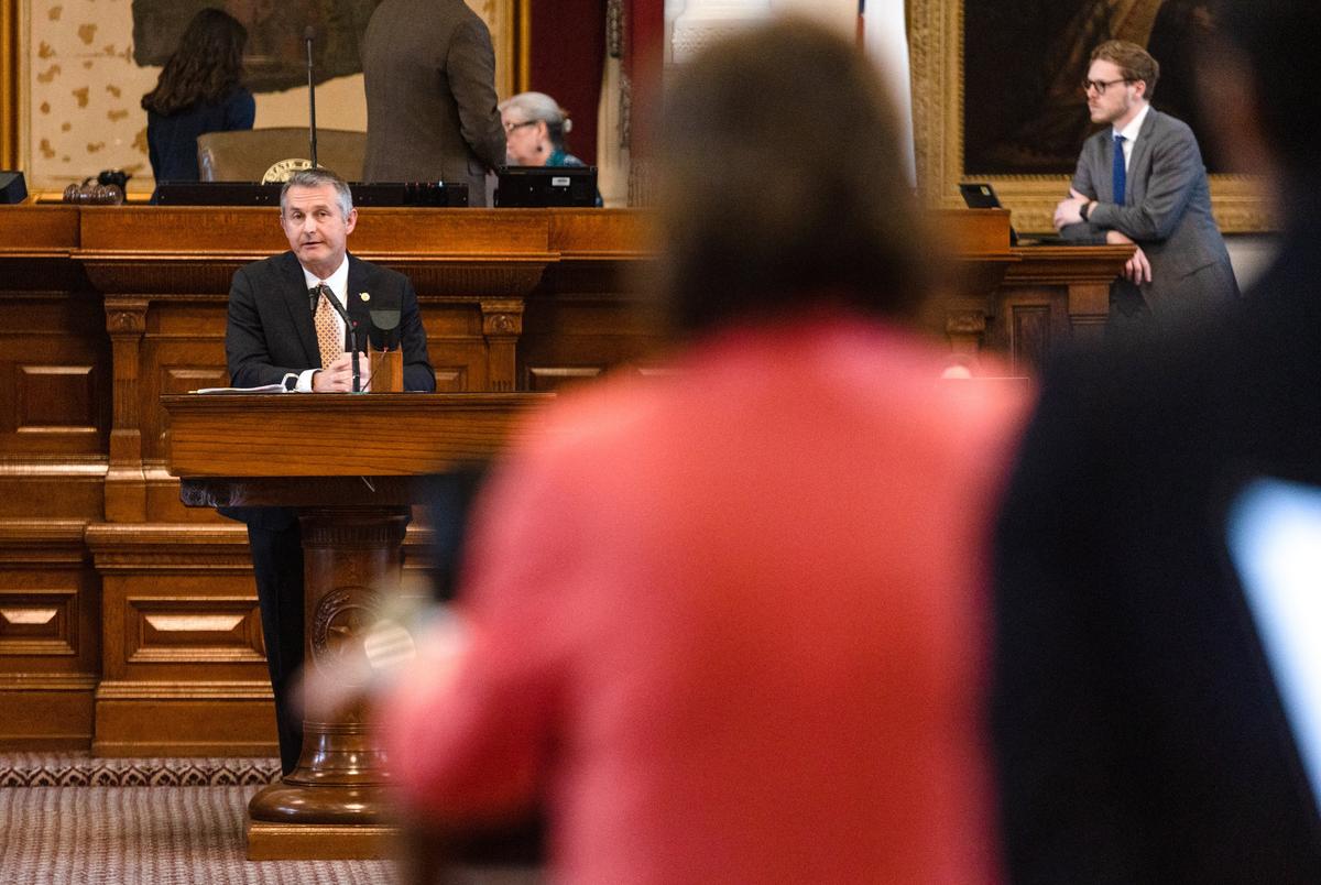 State Rep. Tom Oliverson, R-Cypress, answers questions from Rep. Ann Johnson, D-Houston, on SB 14, which seeks to ban puberty blockers and hormone therapies for transgender youth, for it's second reading on the House floor at the state Capitol in Austin on May 12, 2023.